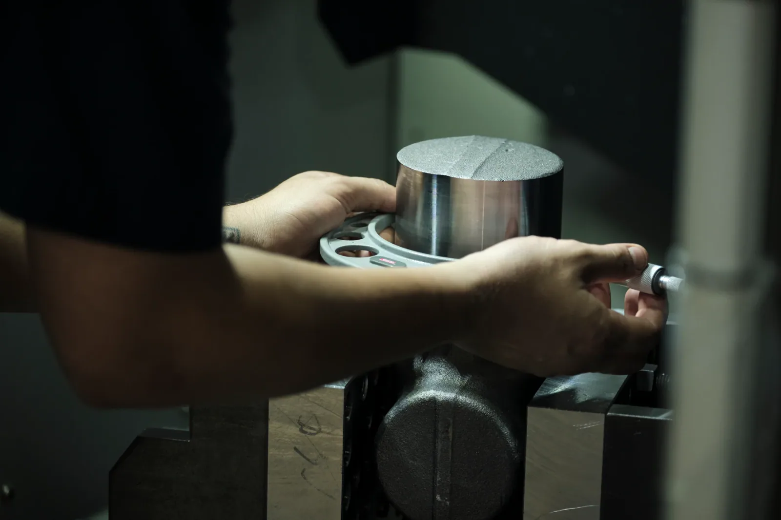 Cactus Flow Control technician measuring a machined component