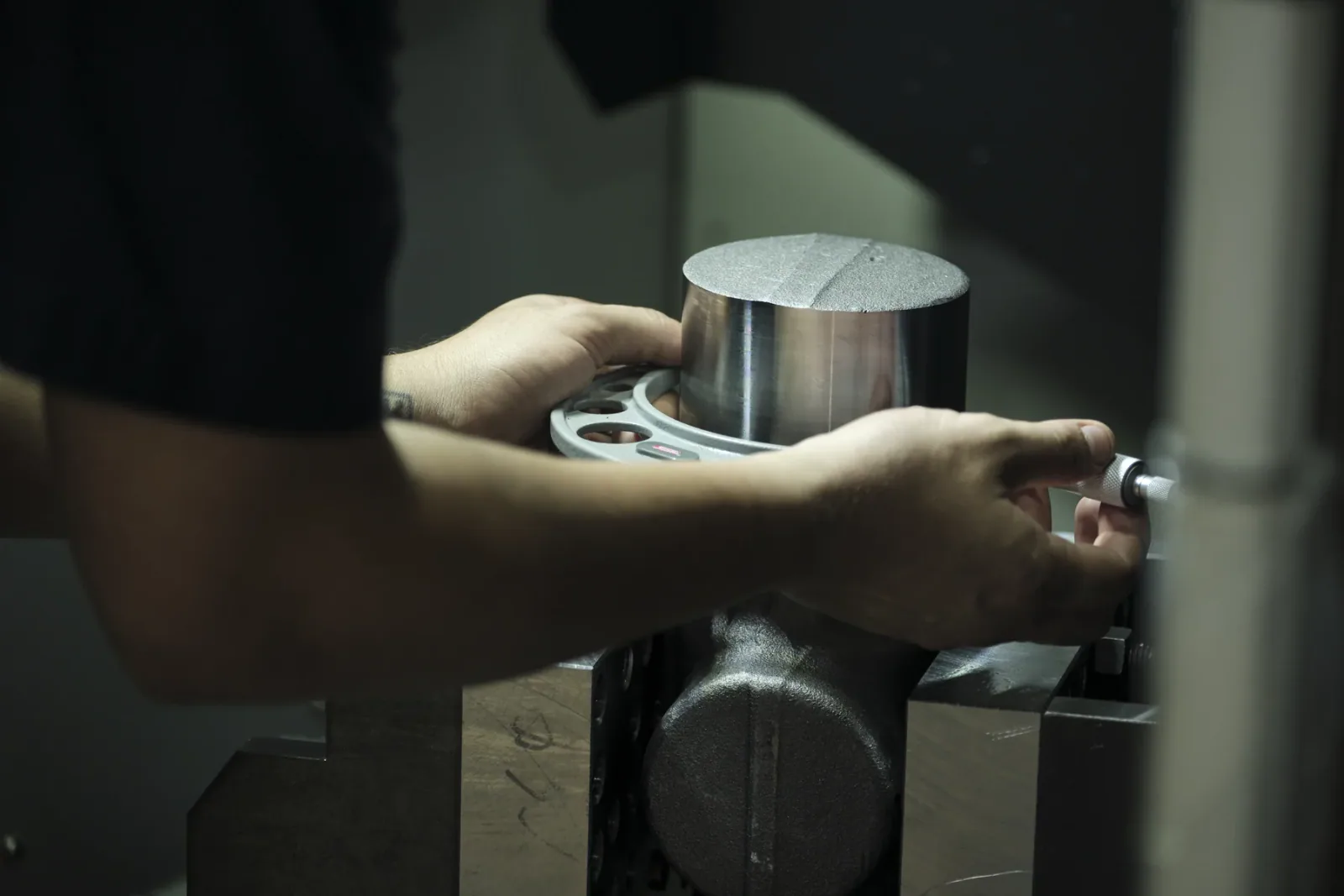 Cactus Flow Control team member inspecting a machined component