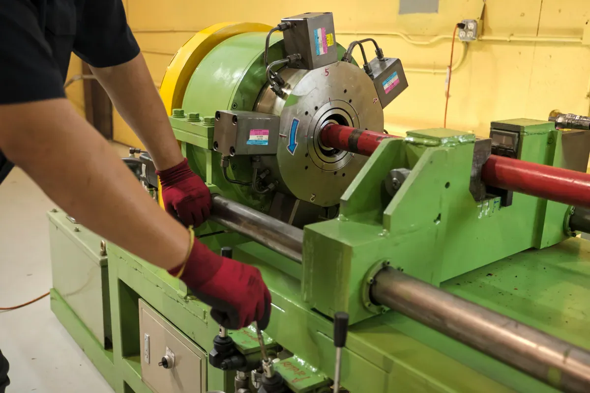 Cactus Flow Control technician setting up a lathe for red iron machining