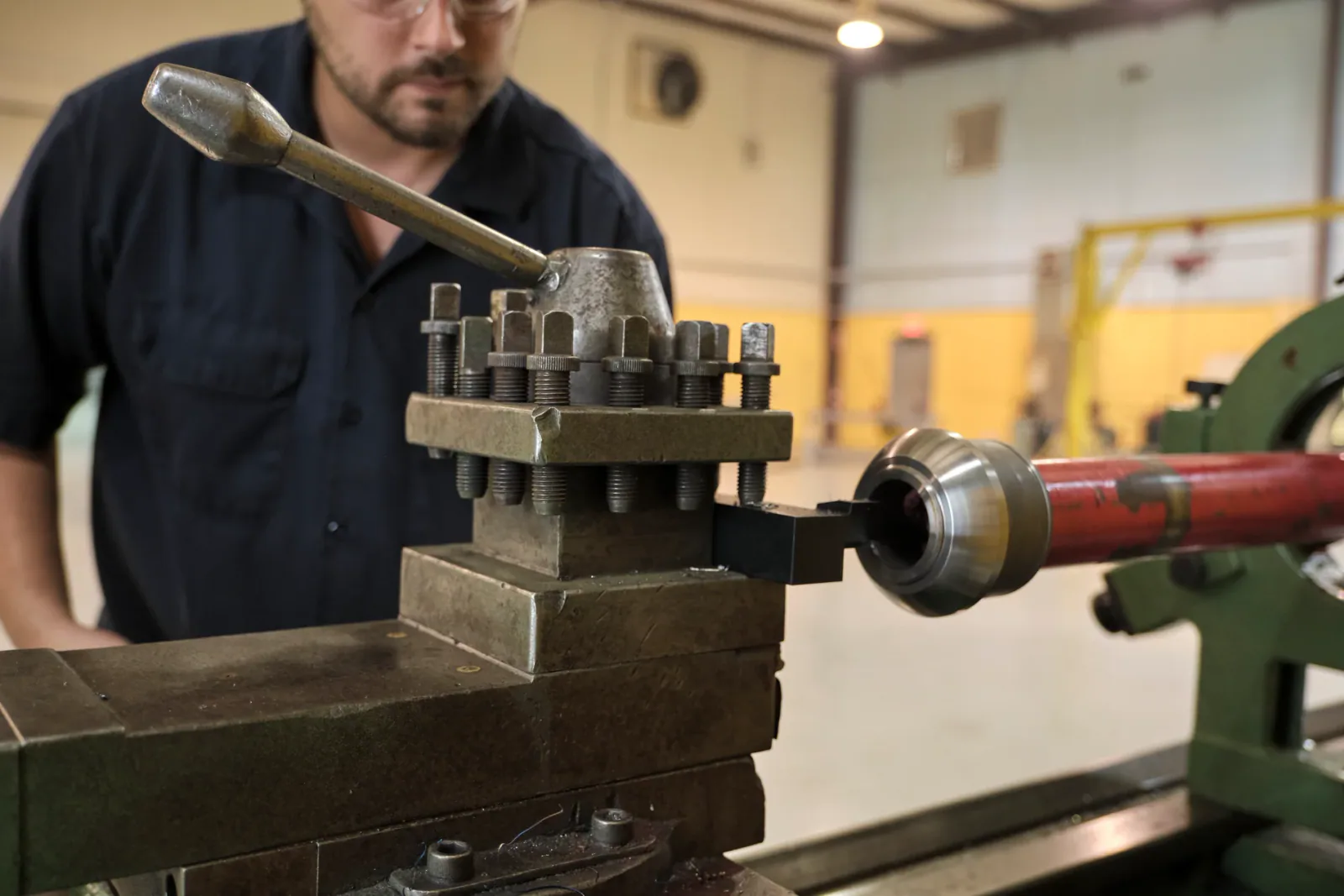 Cactus Flow Control team member machining red iron equipment